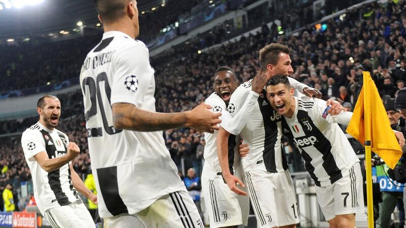 Juventus celebrate Mario Mandzukic’s winner against Valencia. Photograph: Massimo Pinca/Reuters
