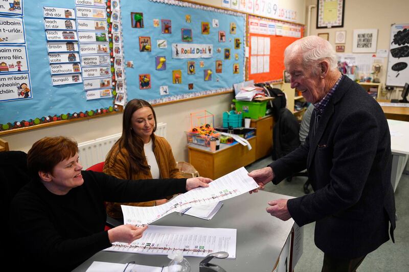People arrive to cast their votes at Dulargy National school in Co Louth, as voters go to the polls. Mark Marlow/PA Wire