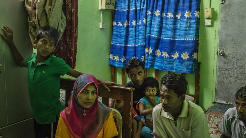 Shahidah Yunus with her husband Dil Muhammad Hussan in the house they share with 17 other Rohingya migrants, in Gelugor, Malaysia. When Yunus’ family could not pay the $1,260 smugglers demanded to complete her safe passage out of Myanmar, she agreed to marry a man she had never met who would pay for her freedom. Photograph: Mauricio Lima/The New York Times