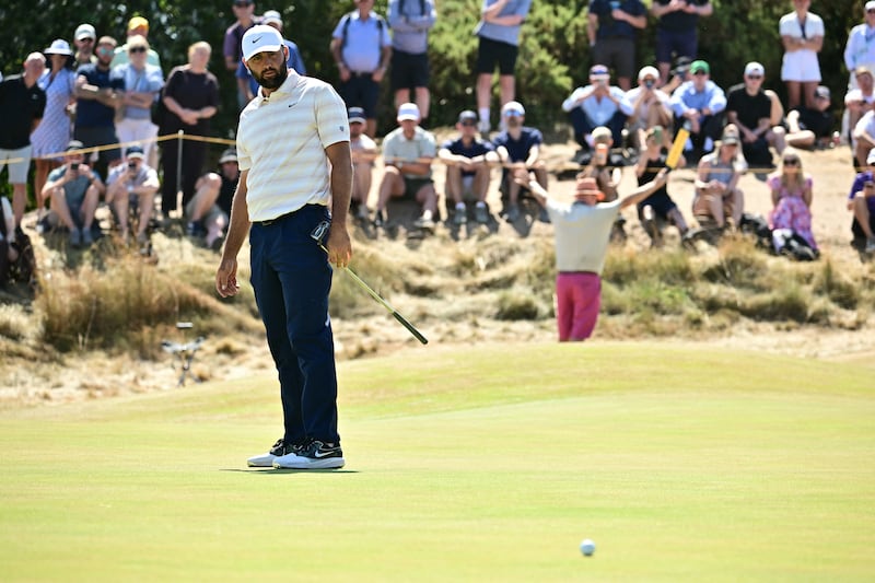 Scottie Scheffler watches his putt on the 10th green on day four of the The Open. Photograph: Ben Stansall/AFP via Getty