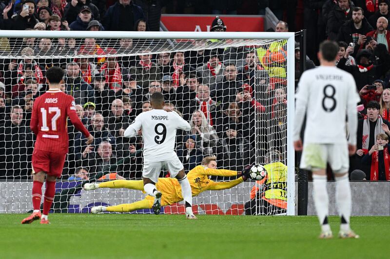 Caoimhín Kelleher of Liverpool saves a penalty from Kylian Mbappé. Photograph: Justin Setterfield/Getty