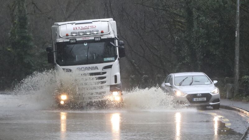 Vehicles are driven through flood water in Mallow, Co Cork, where the River Blackwater  burst its banks in February. Photograph: Niall Carson/PA Wire