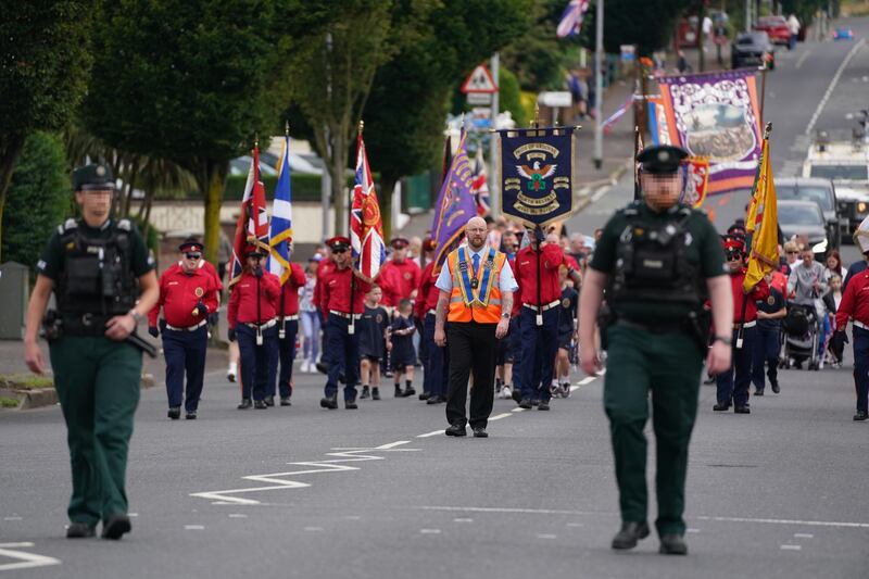 An Orange Order parade makes its way along the Crumlin Road towards the Ardoyne shops in Belfast. Photograph: Brian Lawless/PA Wire