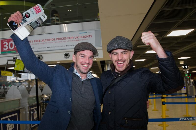 SURE BET: Racing fans Mark Shallow (left) and Gavan Connell, both from Tuam, Co Galway, at Dublin Airport before heading off for the Cheltenham racing festival. Photograph: Gareth Chaney/Collins Photos