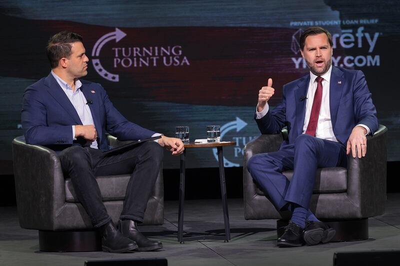 US vice-president JD Vance (right) speaks with Turning Point USA spokesperson Andrew Kolvet during an event in Athens, Georgia, on Tuesday. Photograph: Chip Somodevilla/Getty Images