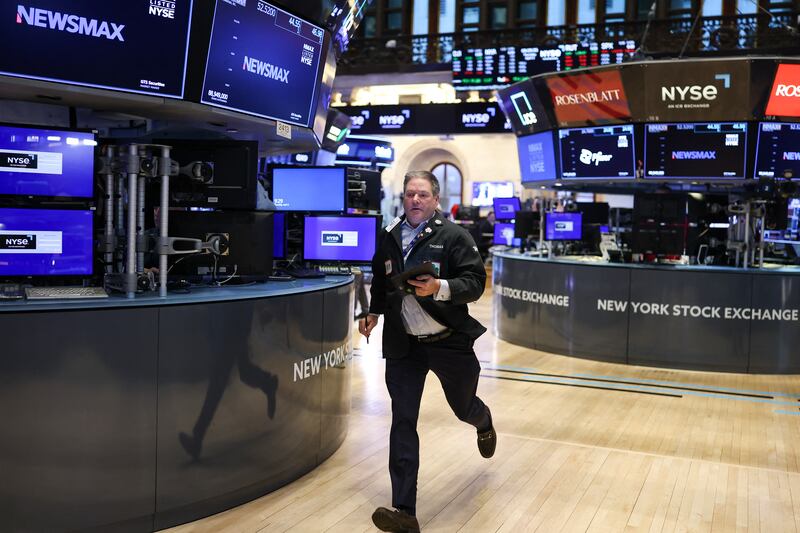 A trader runs on the floor of the New York Stock Exchange at the opening bell in New York City on April 3rd, 2025. Wall Street stocks sank in early trading, joining a global equity selloff after President Donald Trump's latest tariff announcement. Photograph: Charly Triballeau/AFP/Getty
