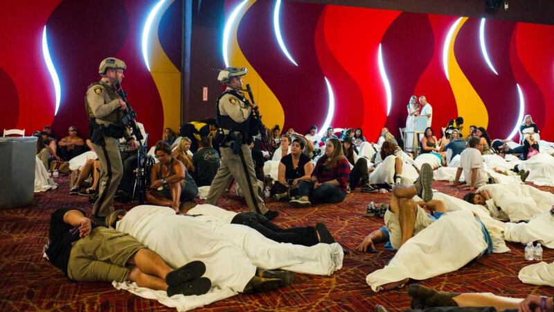 Mandalay Bay massacre: Las Vegas police sweep through a convention centre during the lockdown. Photograph: Chase Stevens/Las Vegas Review-Journal via AP