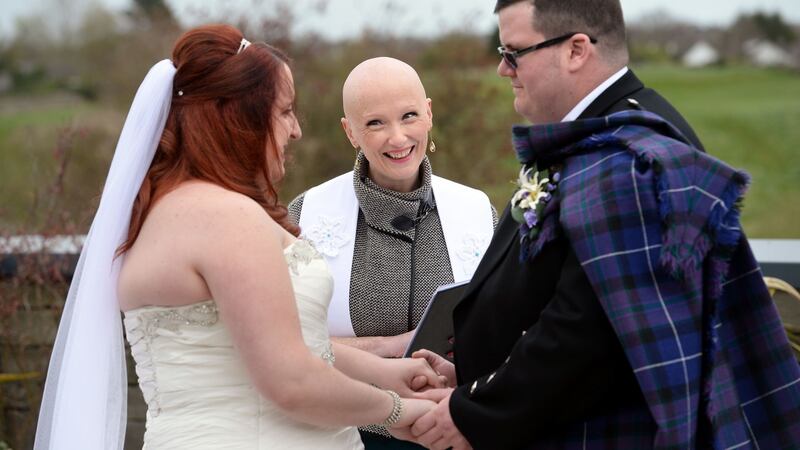 Rev Karen Dempsey performing the wedding ceremony of Ashley and Gary Zanavich, at Trim Castle Hotel,  Co Meath. Photograph: Dara Mac Dónaill