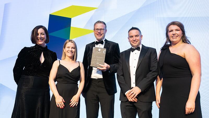 Gerard de Brun, director and founder, Fiontar Group, presents the Fit Out Client of the Year award to RKD team.