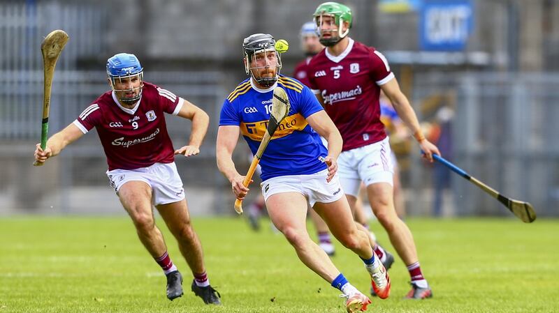 Tipperary’s Dan McCormack is challenged by Galway’s Johnny Coen. Photograph:  Ken Sutton/Inpho