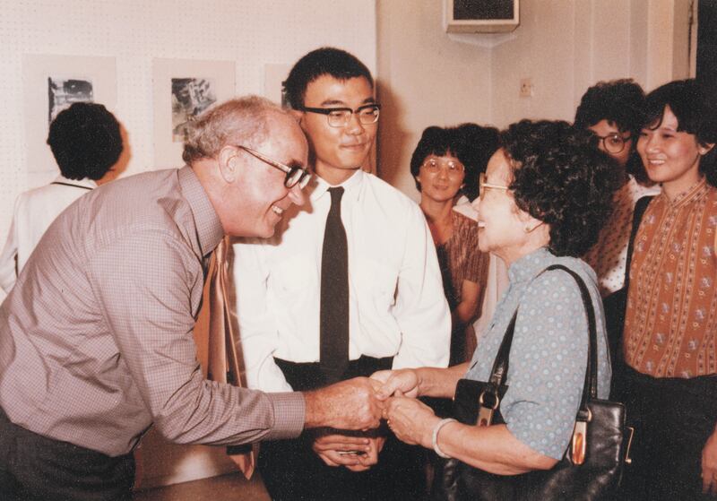 Br Joseph McNally congratulating family members at a student’s exhibition in the early 1980s