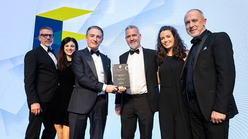 Darragh Elliott, managing director, Elliott Group, presents the Fit Out Project of the Year - Public Sector award to Henry J Lyons team.