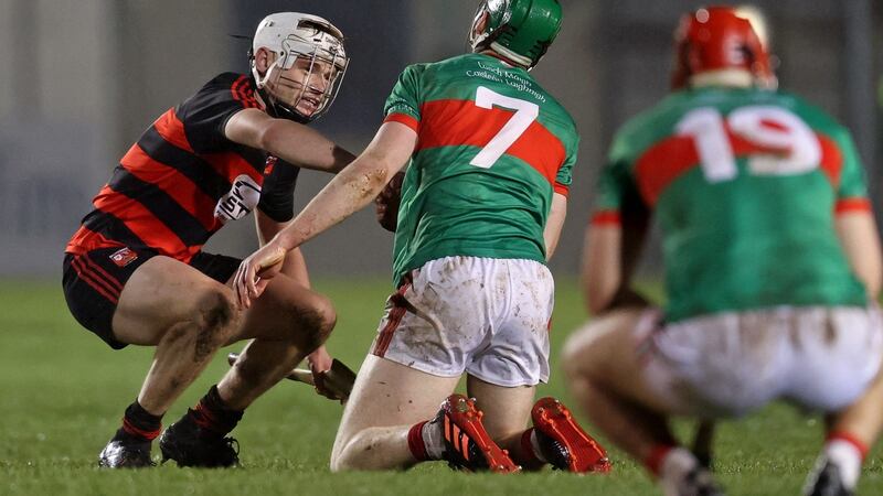 Ballygunner’s Dessie Hutchinson consoles Brian McGrath his side’s win over Loughmore-Castleiney. Photograph:  Tom Maher/Inpho