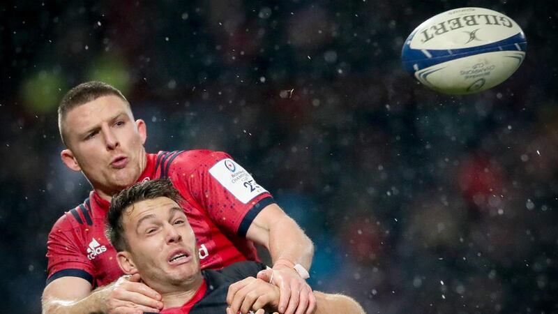Munster’s Andrew Conway battles for possession with Alex Lewington of Saracens during the Heineken Champions Cup match  at Thomond Park. Photograph: Oisín Keniry/Inpho