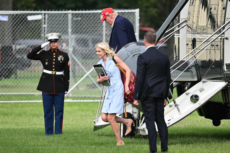 US president Donald Trump and aide Natalie Harp exit the Marine One helicopter near the White House on August 16th, 2026. Photograph: Mandel Ngan/AFP/Getty
