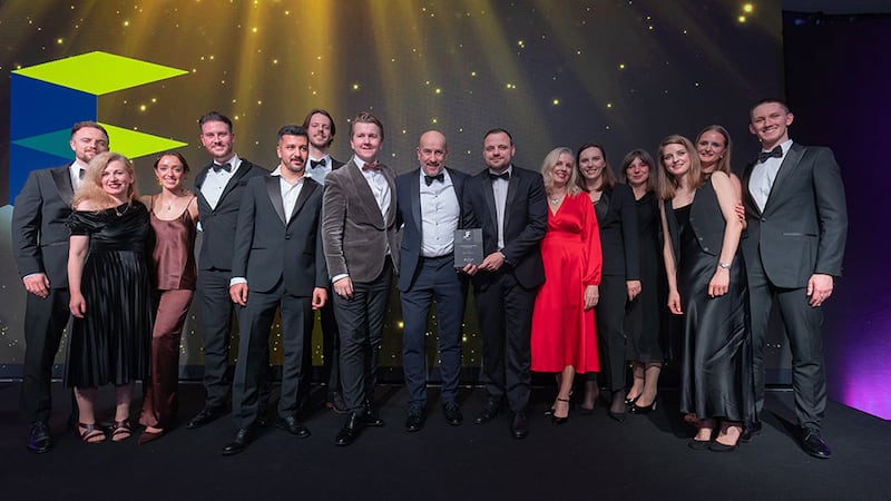 Gareth Heaney, director at Johnston Fit Out, presents the fit out design practice of the year award to Mola Architecture team