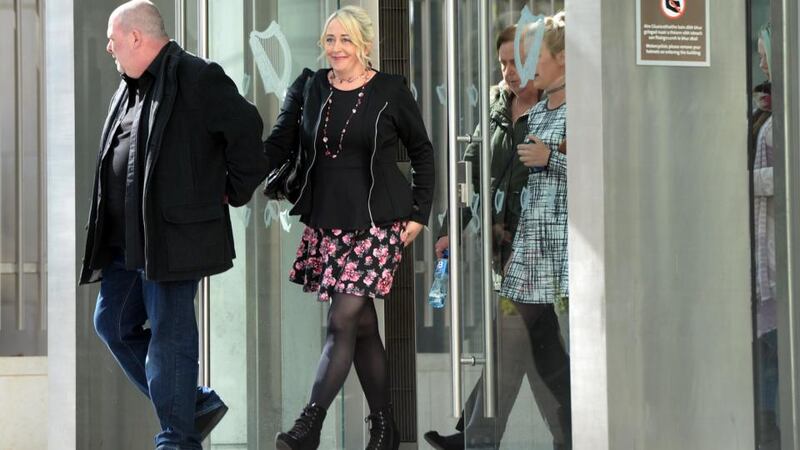 Gail O’Rorke accompanied by her husband, Barrie, leaves the Circuit Criminal Court. Photograph: Eric Luke.