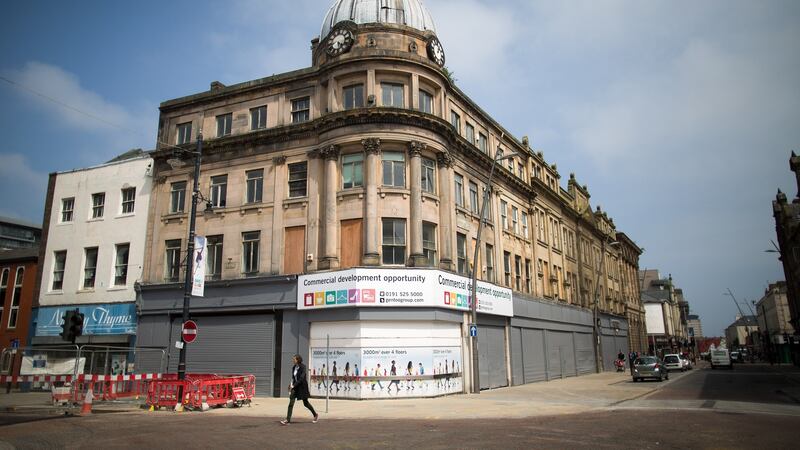 A pedestrian walks past shuttered shops on a high street in Sunderland.  The city was  a bellwether for how much people want to leave the world’s largest trading bloc rather than embrace it. Photograph: Simon Dawson/Bloomberg via Getty Images