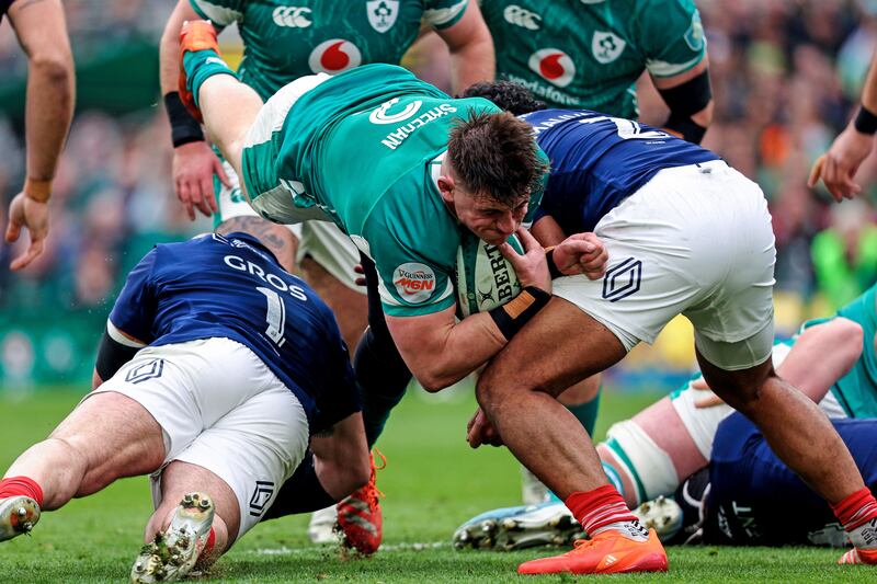 Ireland's Dan Sheehan is tackled by France's Jean-Baptiste Gros and Peato Mauvaka. Photograph: Ben Brady/Inpho