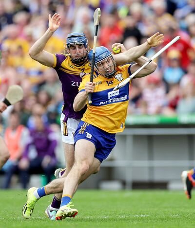 Clare's Shane O’Donnell and Shane Reck of Wexford. Photograph: Laszlo Geczo/Inpho