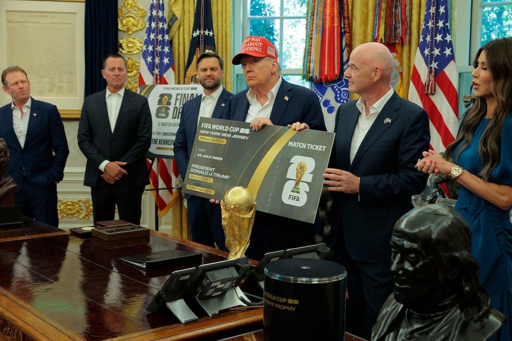 Fifa president Gianni Infantino and US president Donald Trump hold a large World Cup ticket replica in the Oval Office. Photograph: Chip Somodevilla/Getty