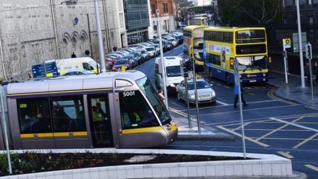 Longer and more frequent Luas trams will travel through College Green by the end of March, requiring priority access to meet journey-time targets. File photograph: Cyril Byrne