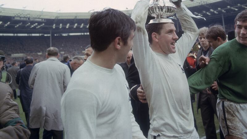 Dave Mackay lifts the FA Cup on his head as he celebrates Spurs’ 2-1 win over Chelsea. “I have a recollection of watching the 1967 final on telly. Black and white. Chelsea were playing Spurs and I decided I was up for Chelsea. They lost but it didn’t matter. That was it, for life.”  Photograph:  George Freston/Fox Photos/Getty Images