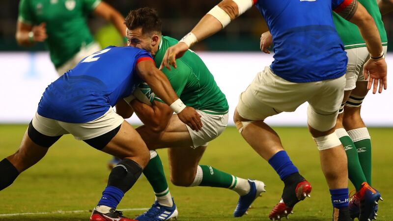 Ireland’s Jacob Stockdale is tackled by Samoa’s Seilala Lam -  for which the hooker was shown a yellow card. Photograph Michael Steele/Getty