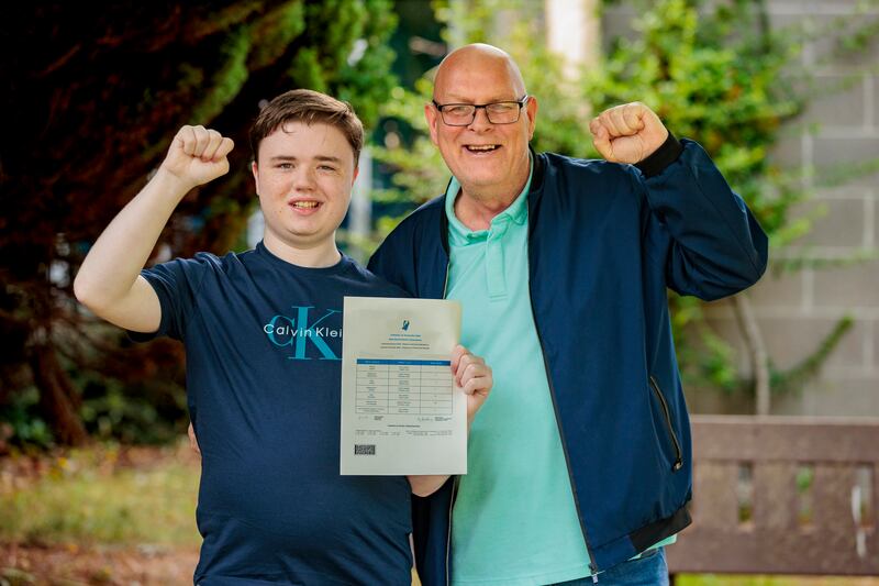 Hayden Dockerty and his special needs assistant, Aidan Somers, pose for a photo at The Donahies Community School in Dublin, after Hayden received his Leaving Certificate results.  Photograph: Liam McBurney/PA Wire