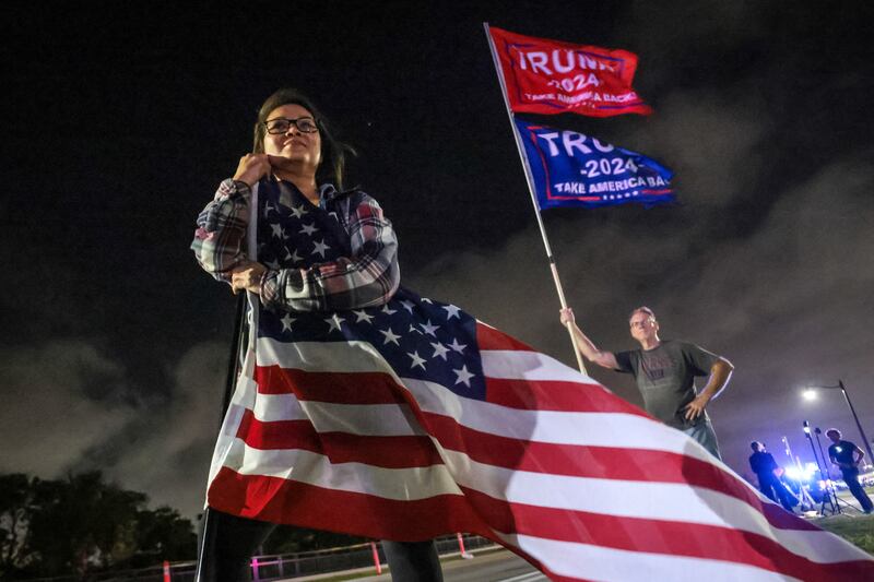 Supporters of Donald Trump gather near his Mar-a-Lago resort in Palm Beach, Florida, on election day. Photograph: GIORGIO VIERA/AFP via Getty Images
