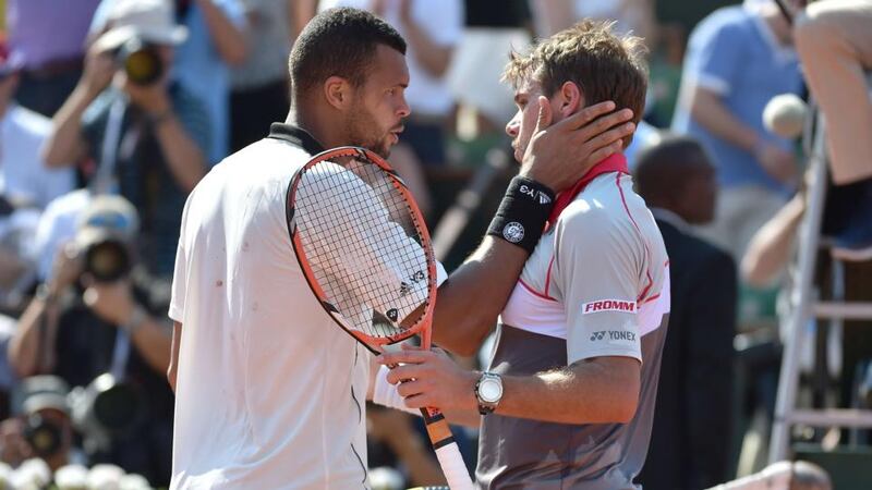 France’s Jo-Wilfried Tsonga (left) congratulates Switzerland’s Stanislas Wawrinka on winning their men’s semi-final match at the French  Open. Photo: Pascal Guyot/AFP/Getty Images