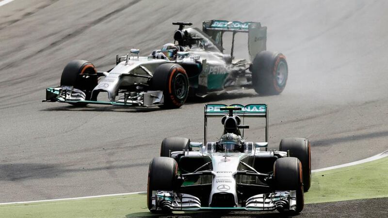 Mercedes  driver Lewis Hamilton (top) of Britain passes his team-mate Nico Rosberg of Germany during the Italian  Grand Prix at Monza. Photograph: Max Rossi  /Reuters