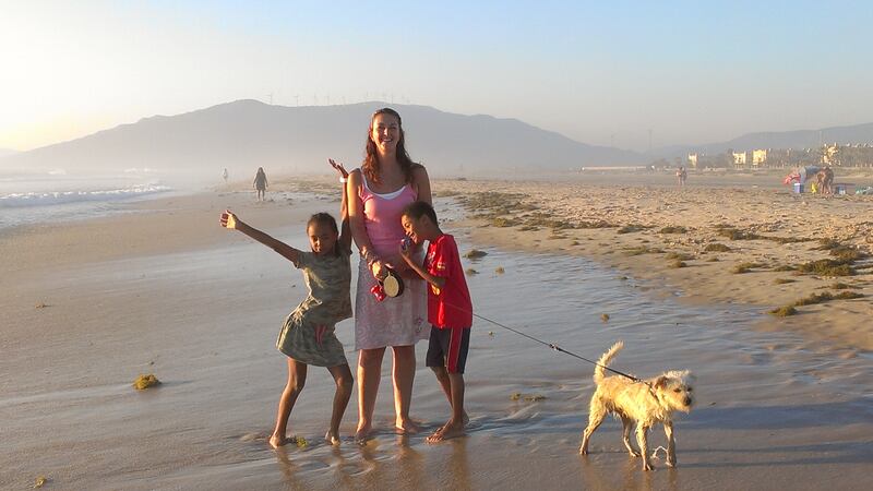Fiona Austin with her children on the beach in Tarifa, Spain