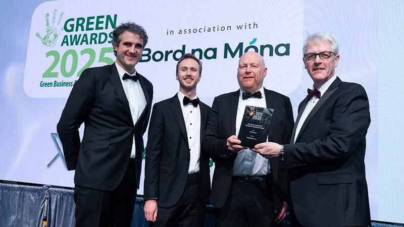 Owen Power, head of marketing & CX, presents the green logistics & transport company award to DPD Ireland team