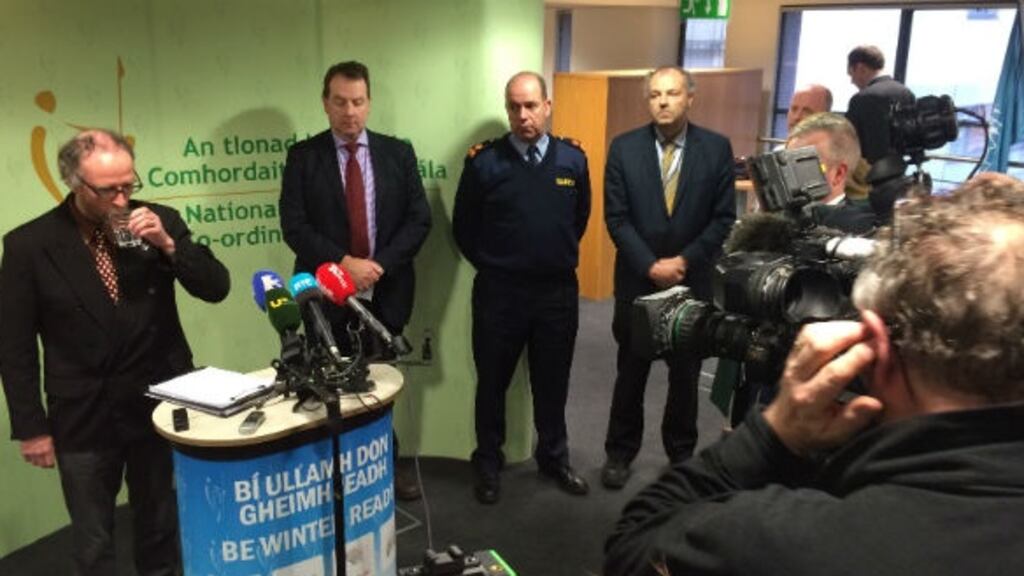 Members of the National Emergency Coordination Group prepare to brief the media.