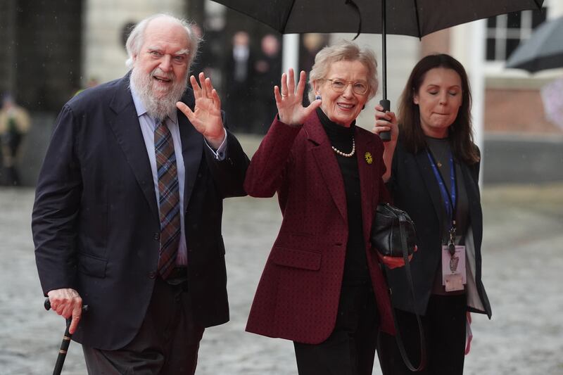 Former president Mary Robinson (centre) and her husband Nicholas Robinson (left) arrive at Dublin Castle for the inauguration. Photograph: Brian Lawless/PA Wire