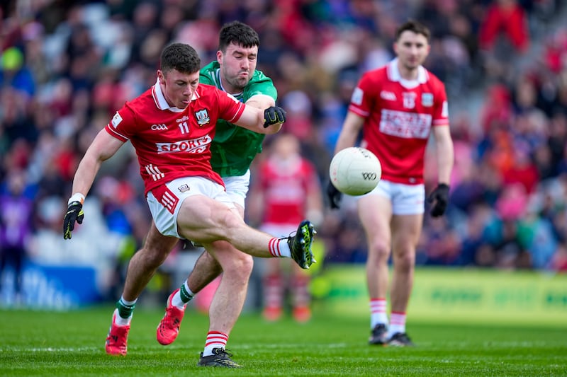 Mark Cronin of Cork kicks a point during their Munster SFC game against Limerick. Photograph: James Lawlor/Inpho