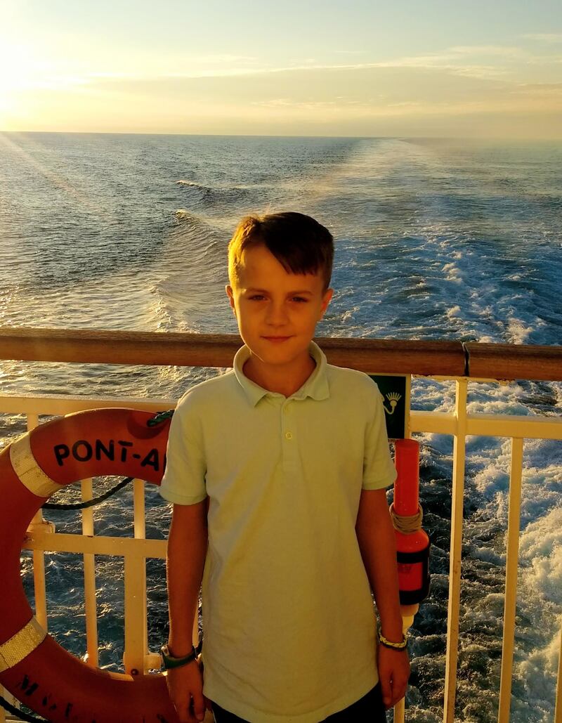 Samuel, aged 10, on a ferry