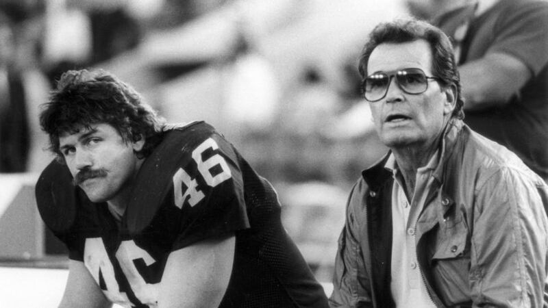Los Angeles Raiders tight end Todd Christensen and actor James Garner on the bench during game against  Cleveland Browns at Los Angeles Memorial Coliseumin Los Angeles. Photograph:  Vic Milton/Getty Images