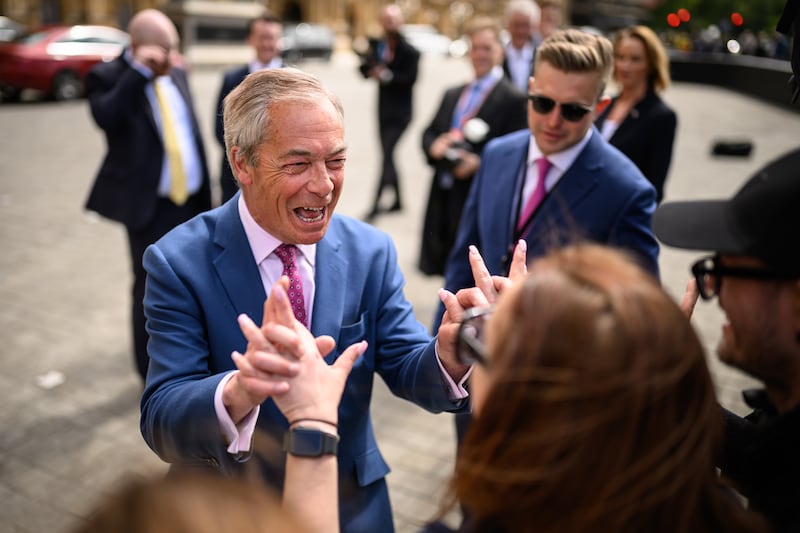 Nigel Farage, Reform UK leader, greets a member of the public after his party performed strongly in elections in England. Photograph: Leon Neal/Getty