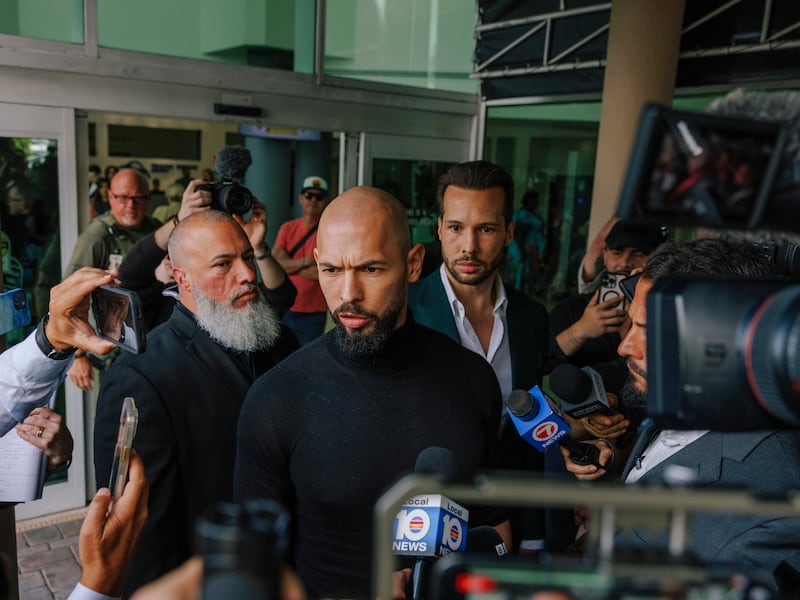 Andrew Tate speaks to reporters after he, and his brother Tristan Tate, arrived in Florida last February. Photograph: James Jackman/The New York Times