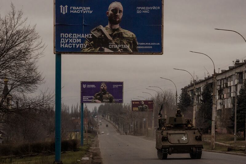 Ukrainian billboards encouraging people to enlist in the army, in Kostyantynivka, Ukraine. Photograph: Daniel Berehulak/The New York Times
                      