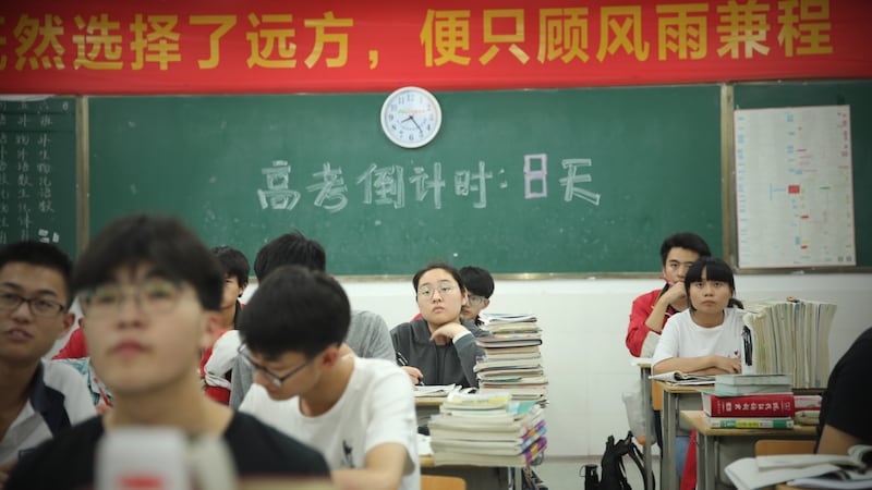Students study in a classroom at night for  the  National College Entrance Examination in Fuyang, China: There are more than half a million schools across the country, with 265 million students in the largest public education sector in the world. Photographs: VCG/VCG/Getty
