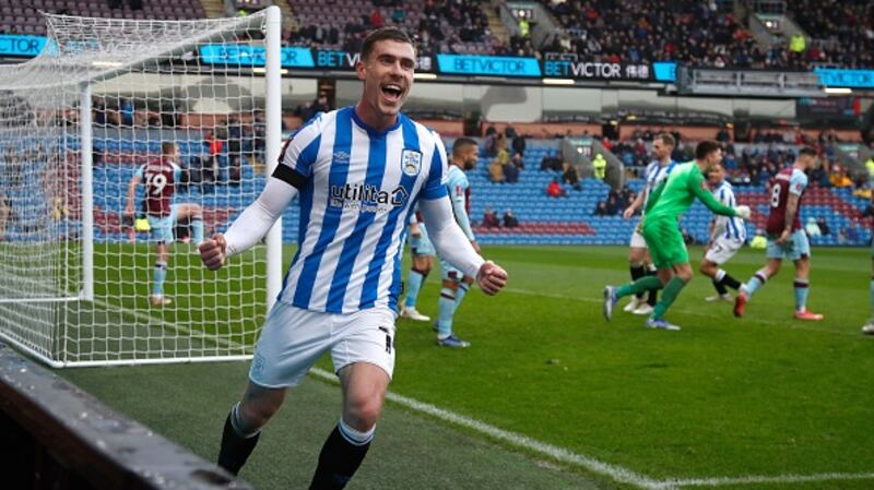 Josh Ruffels of Huddersfield Town celebrates after Town score the winner against Burnley. Photograph:  John Early/Getty Images