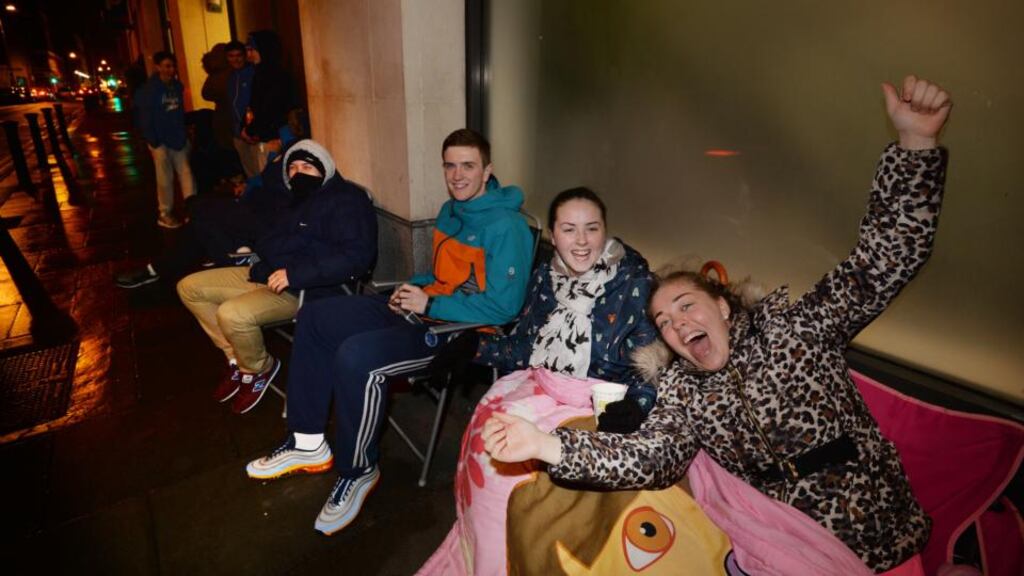 Gary O’Connor, Nicole Dunne and Chantelle Byrne, who began queuing at 5pm on Wednesday, have set up camp outside the Jervis Street centre in Dublin to purchase Ed Sheeran tickets which go on sale at 9am on Thursday morning. Photograph: Alan Betson / The Irish Times