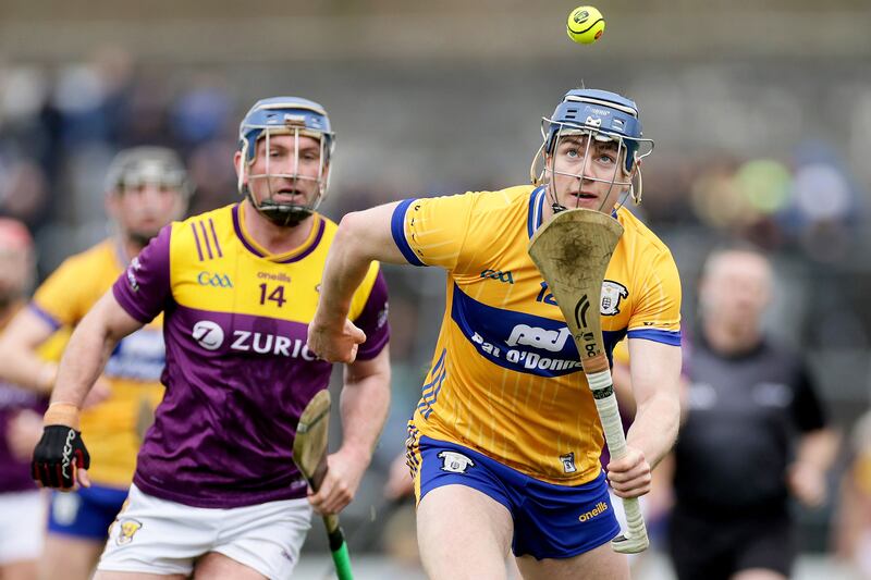 Clare's Jack O’Neill in action against Wexford's Kevin Foley during the Division 1B game at Cusack Park earlier this month. Photograph: Laszlo Geczo/Inpho