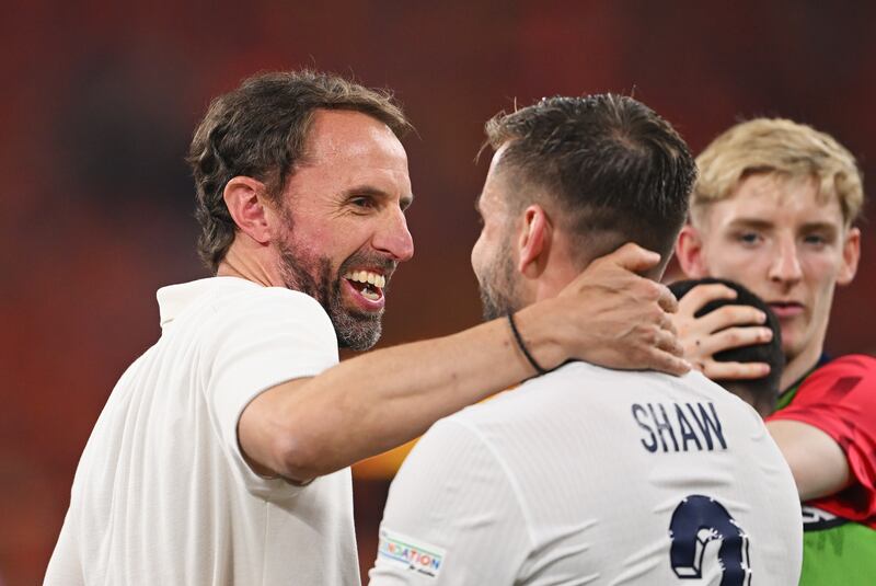 Gareth Southgate and Luke Shaw enjoy a moment of togetherness as England's win over the Netherlands on Wednesday. Photograph: Stu Forster/Getty Images