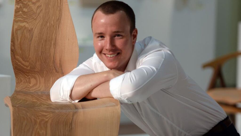 Enda Scott (30) wins RDS Award of Excellence for his Obliquity chair. Photograph: Dara Mac Dónaill / The Irish Times