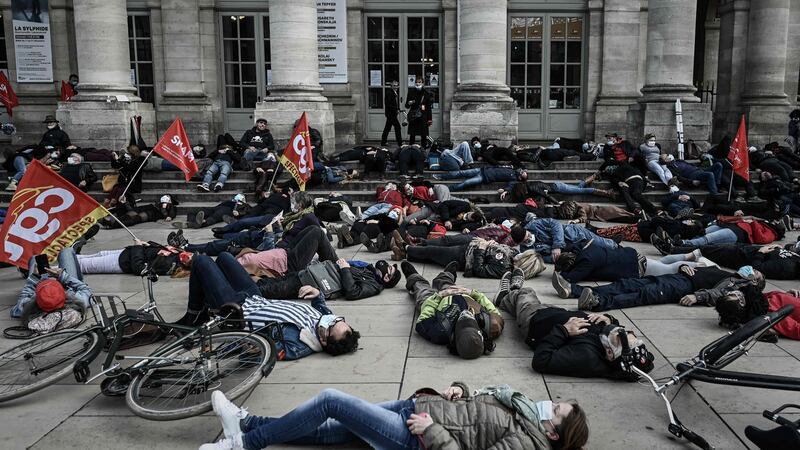 Members of workers unions of artists and technicians from the entertainment sector lay on the ground during a demonstration against what they say is inadequate and insufficient aid by the government  in front of the Grand Theatre in Bordeaux, France on Friday. Photograph: Philippe Lopez/AFP