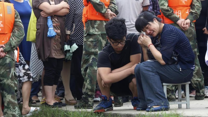 Frustrated by the scarcity of information from local authorities, about 50 family members hired a bus to take them from Nanjing to Jianli county in Hubei, an eight-hour journey.  Photograph: AFP/Getty Images